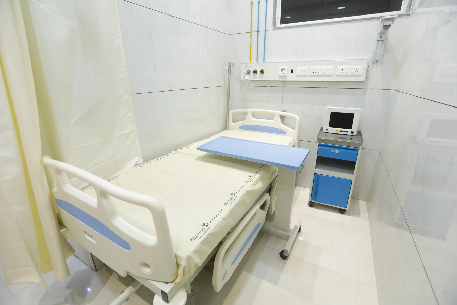 Patient bed with overbed table