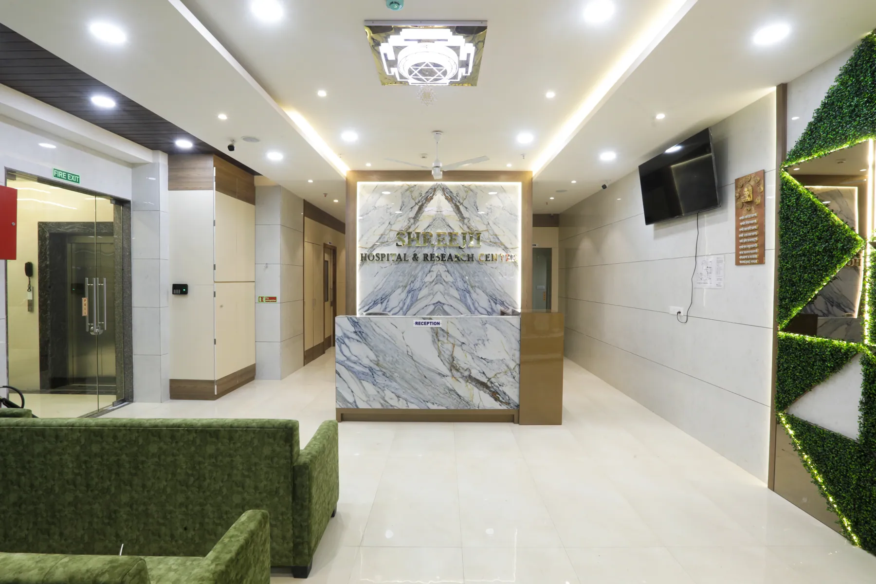 Main reception desk and lobby with green seating
